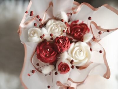 A beautiful floral arrangement featuring red and white roses, perfect for romantic events like Valentine's Day and Mother's Day.